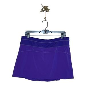 Athleta Runaround Tennis Skort Size L Purple Pleated Back Golf Activewear